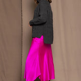 Cashmere Aran Sweater in Grey with a bright pink silk skirt