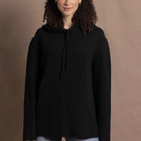 lady wears oversized pure cashmere hoodie sweater in black