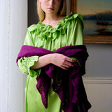 Woman in a purple 100% cashmere scarf wrap shawl and lime green silk ruffle dress