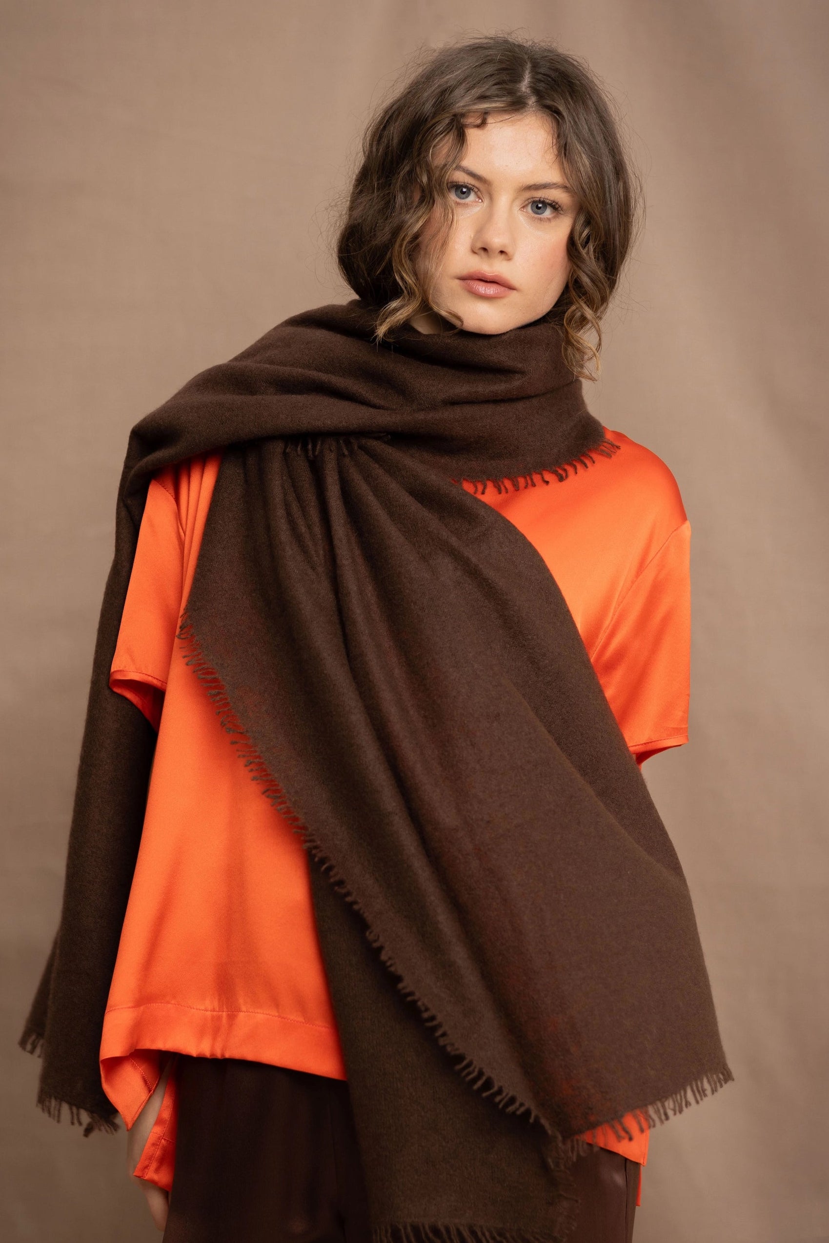 woman wearing a brown cashmere large wrap scarf shawl