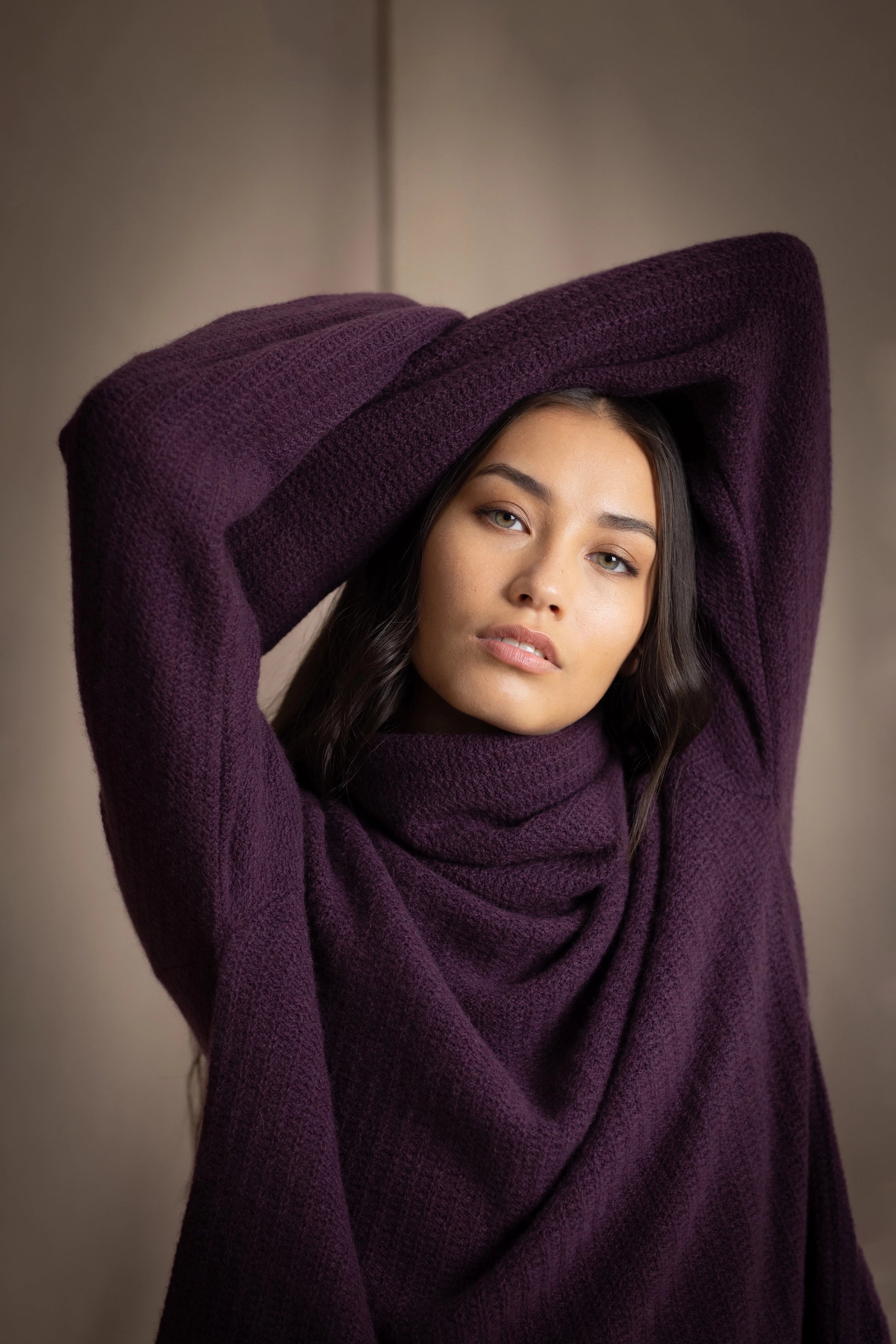 Woman wearing a purple cashmere fisherman sweater or jumper
