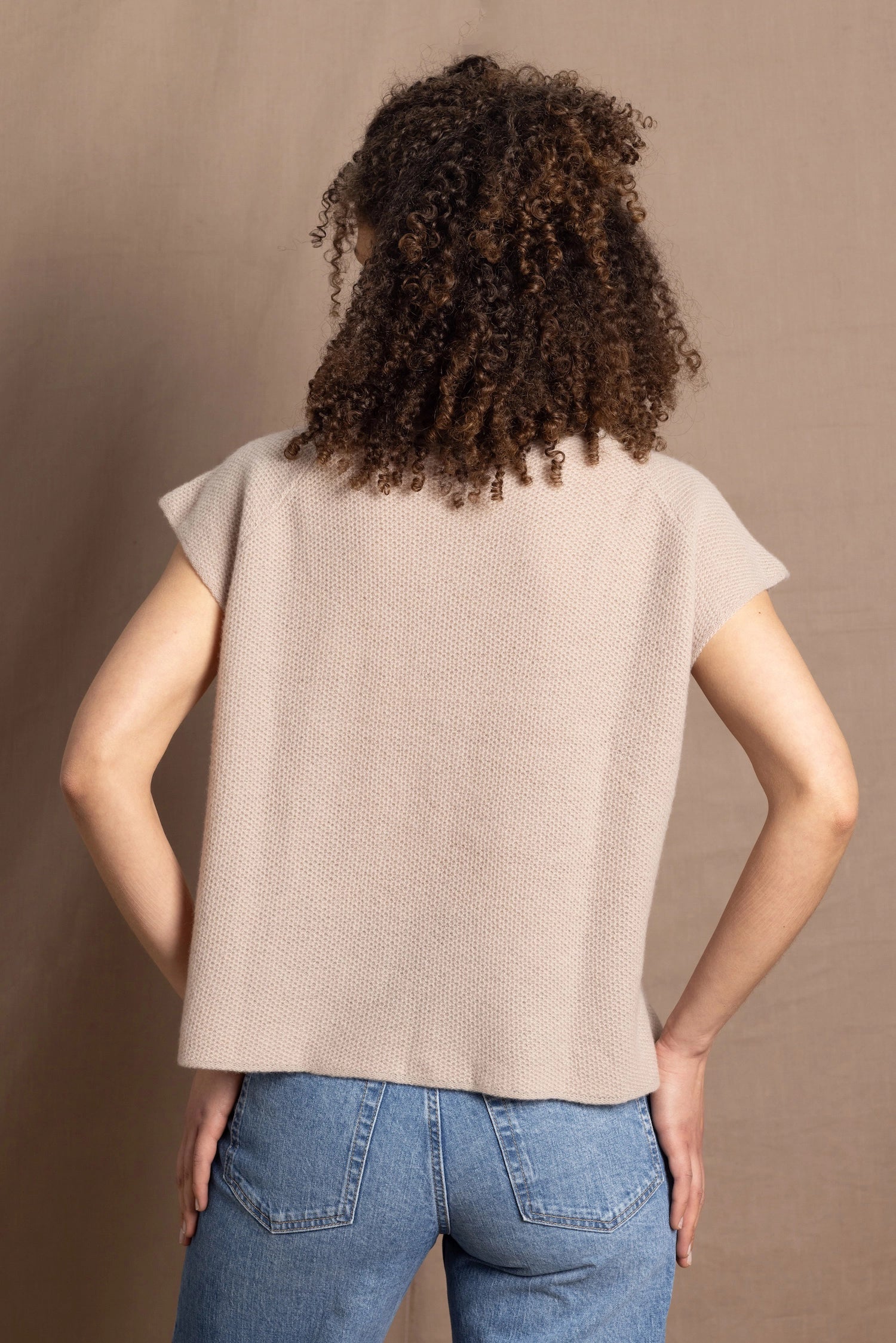 a woman wears pure 100% cashmere tee sweater in beige