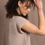 a woman wears luxury cashmere tee sweater in beige