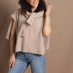 Lady wears luxury cashmere tee sweater in beige with matching beige cashmere cardigan 