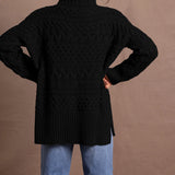 Lady wears pure cashmere aran sweater from Ireland in black