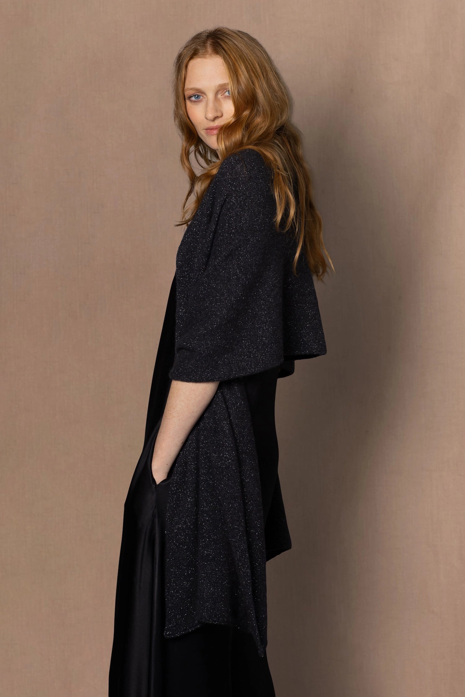 woman wearing a sparkling black and silver cashmere wrap 