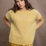 a woman wears a pure 100% cashmere tee sweater in butter yellow with a matching cashmere beanie hat in yellow