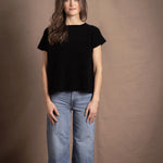 lady standing with 100% cashmere tee short sleeve sweater in black