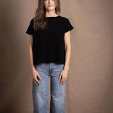 lady standing with 100% cashmere tee short sleeve sweater in black