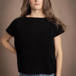 lady standing with 100% cashmere tee short sleeve sweater in black