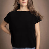 lady standing with 100% cashmere tee short sleeve sweater in black