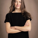 lady standing with 100% cashmere tee short sleeve sweater in black