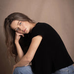 lady standing with 100% cashmere tee short sleeve sweater in black