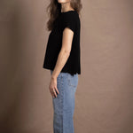 lady standing with 100% cashmere tee short sleeve sweater in black
