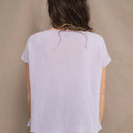 a woman wears a 100% pure cashmere tee sweater in light purple by Irish brand Madigan Cashmere