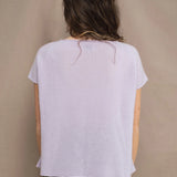a woman wears a 100% pure cashmere tee sweater in light purple by Irish brand Madigan Cashmere