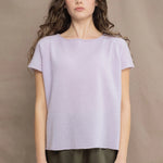 a woman wears a 100% pure cashmere tee sweater in light purple by Irish brand Madigan Cashmere