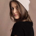 lady wearing luxury cashmere beanie hat in beige