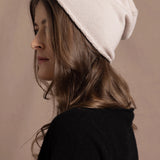 lady wearing luxury cashmere beanie hat in beige