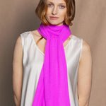 a neon pink cashmere scarf