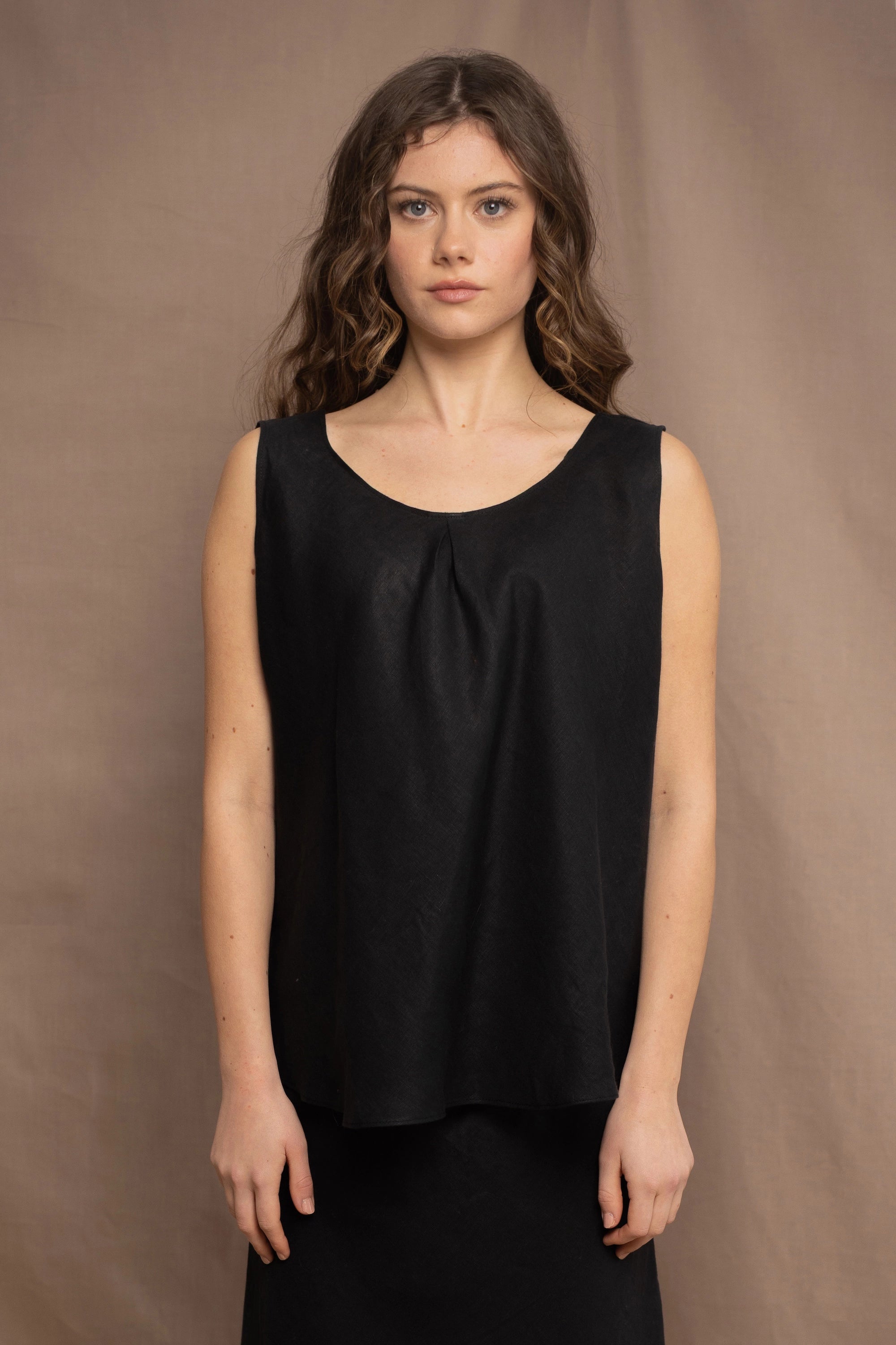 Woman wearing an Irish Linen sleeveless top and skirt  in black