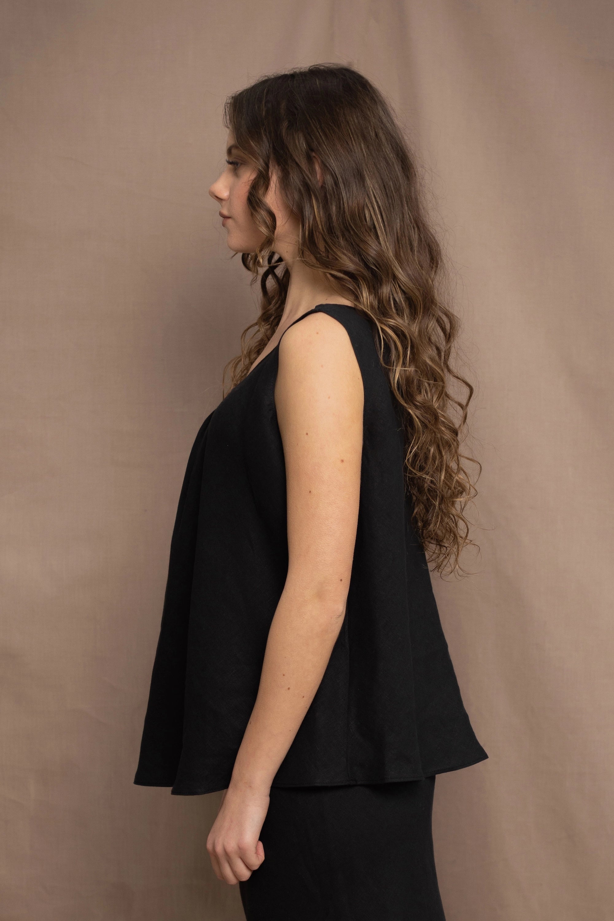 Woman wearing an Irish Linen sleeveless top and skirt  in black