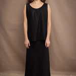 Woman wearing an Irish Linen sleeveless top and skirt  in black