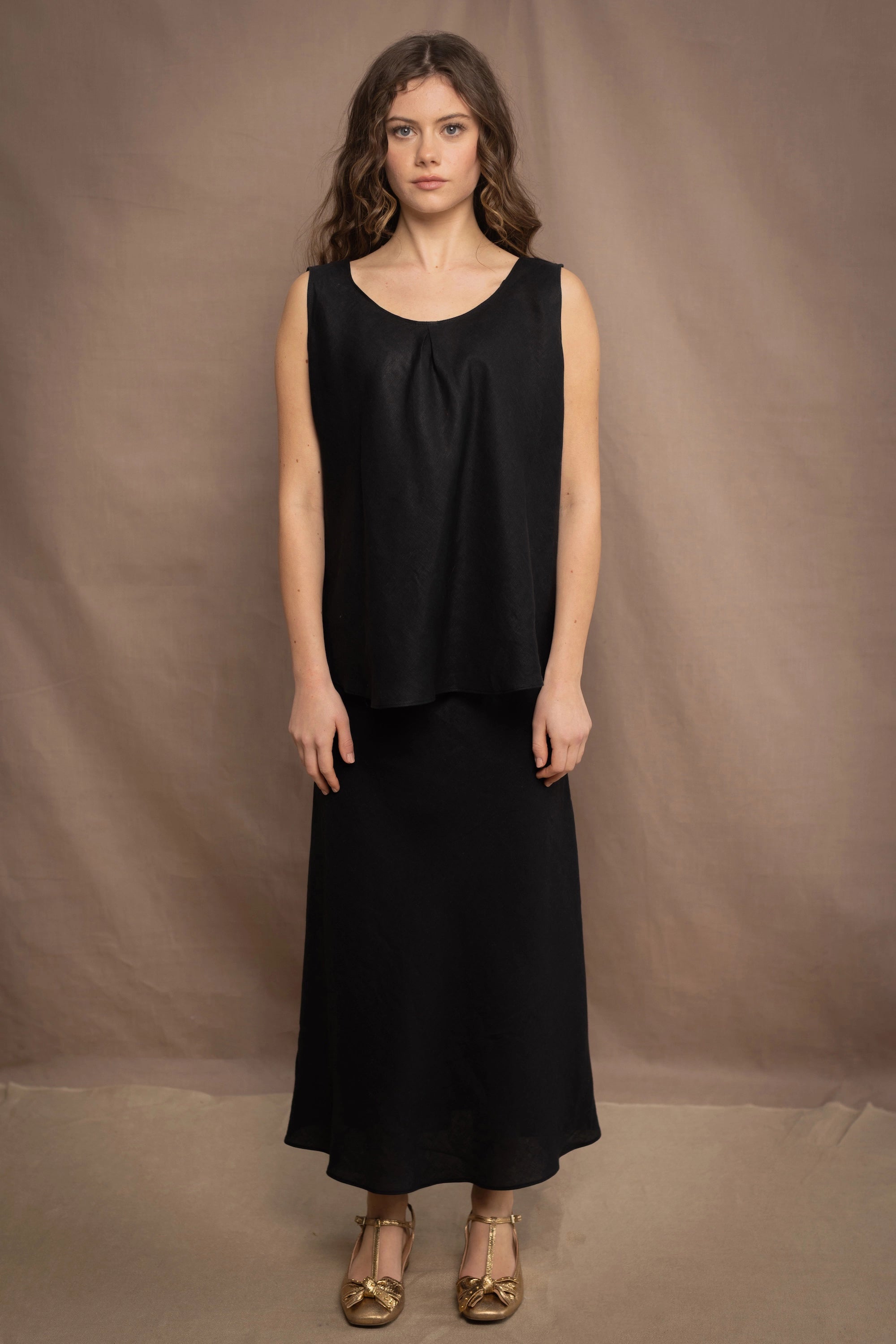 Woman wearing an Irish Linen sleeveless top and skirt  in black