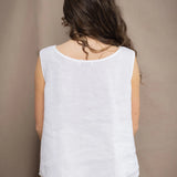 Woman wearing an Irish Linen sleeveless top and matching pants in white