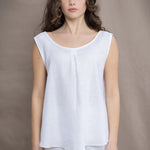 a woman wearing an Irish Linen sleeveless top and matching pants in white