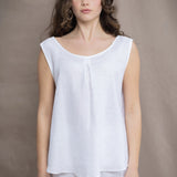 a woman wearing an Irish Linen sleeveless top and matching pants in white