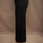 a woman wears a black wide leg Irish linen pants or trousers by Irish brand Madigan