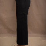 a woman wears a black wide leg Irish linen pants or trousers by Irish brand Madigan
