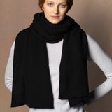 woman wearing a black cashmere scarf wrap 