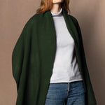 woman wearing a green cashmere wrap shawl scarf