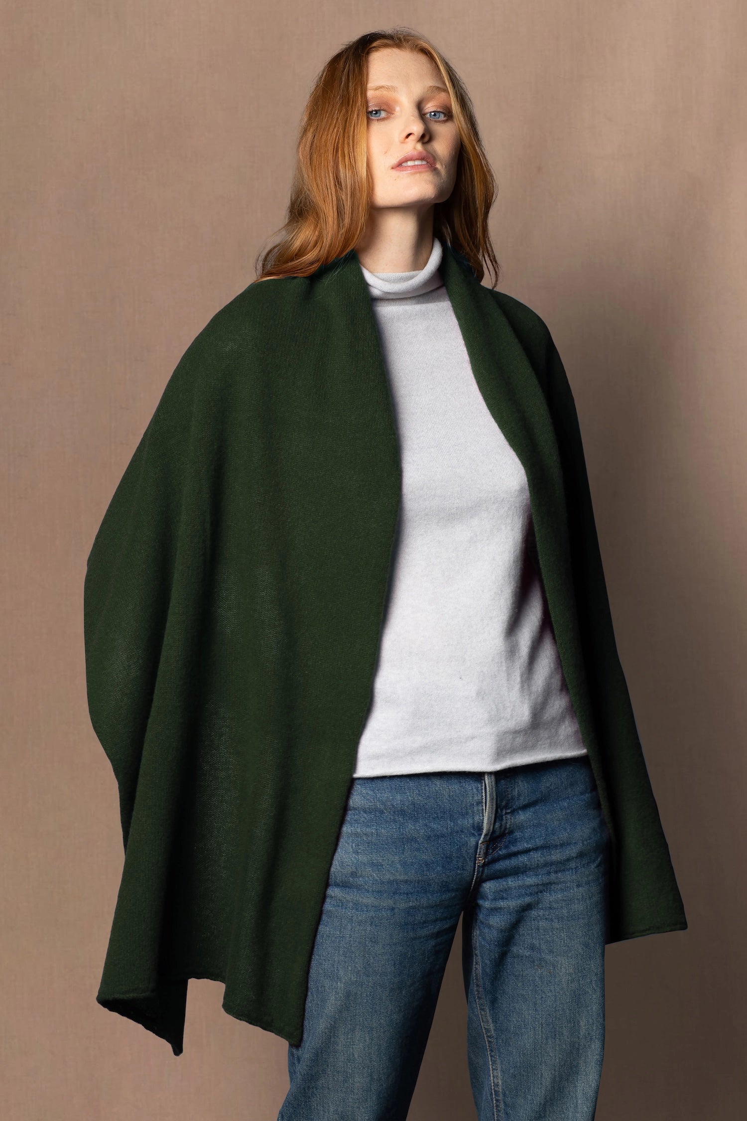 woman wearing a green cashmere wrap shawl scarf