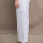 a woman wears a pair of pure Irish linen Cropped trousers in white by Irish brand