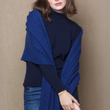 woman wearing a blue cashmere wrap shawl 