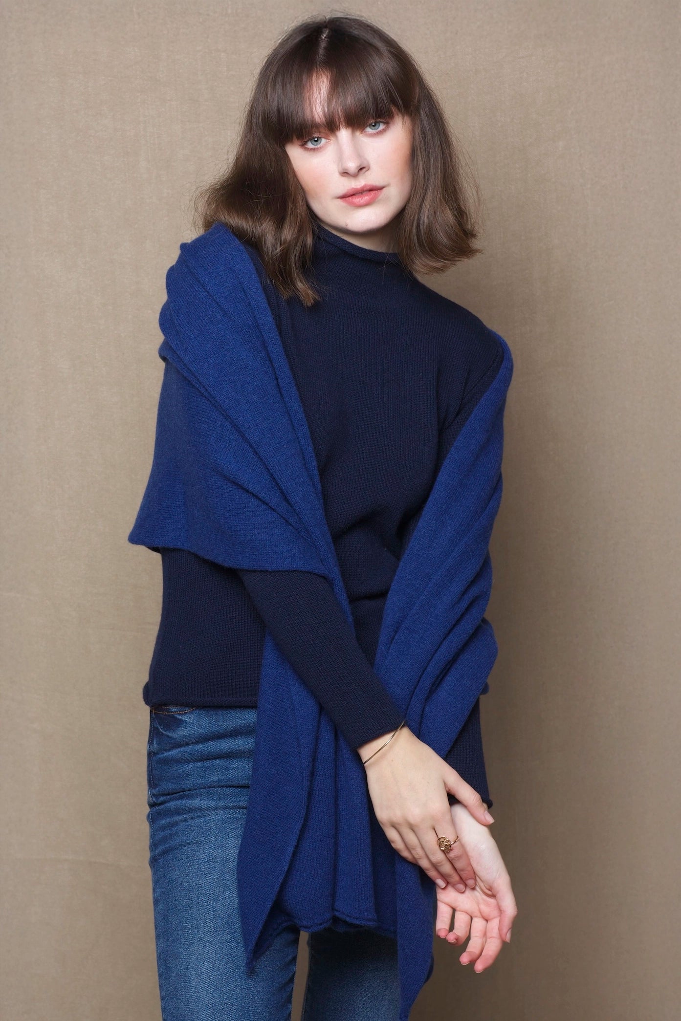 woman wearing a blue cashmere wrap shawl 