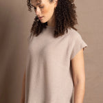 a woman wears luxury cashmere tee sweater in beige