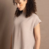 a woman wears luxury cashmere tee sweater in beige