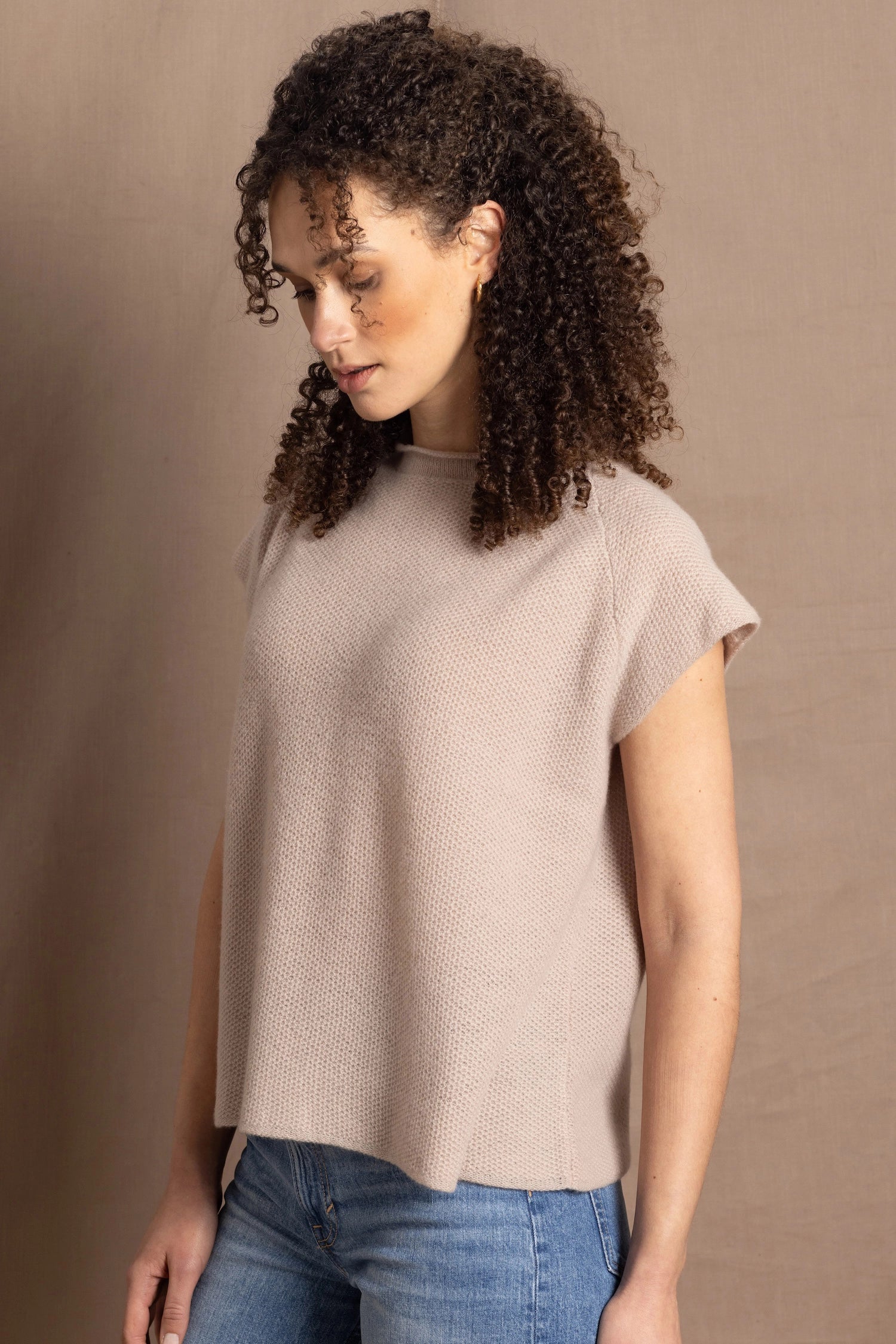 a woman wears luxury cashmere tee sweater in beige
