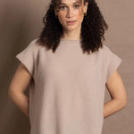 a woman wears luxury cashmere tee sweater in beige