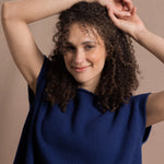 A lady wears a pure 100% cashmere tee sweater jumper in blue 