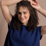 A lady wears a pure 100% cashmere tee sweater jumper in blue 