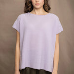 a woman wears a cashmere tee sweater with a moss texture in light pale purple
