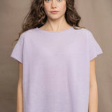 a woman wears a cashmere tee sweater with a moss texture in light pale purple