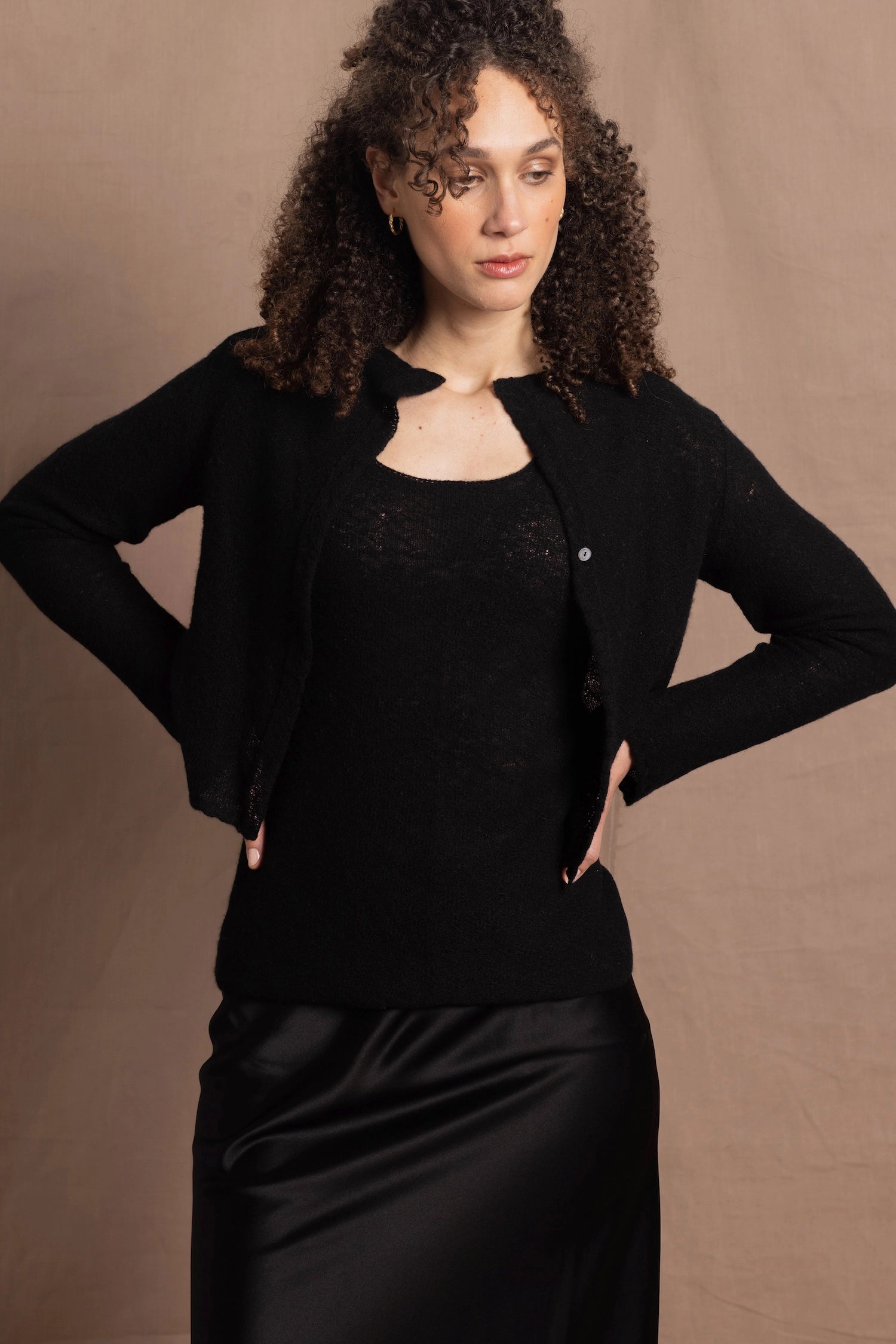 a cashmere lace cardigan sweater in black  with black silk skirt