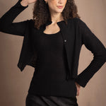 a cashmere lace cardigan sweater in black  with black silk skirt