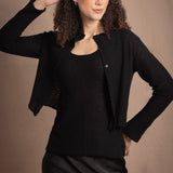 a cashmere lace cardigan sweater in black  with black silk skirt
